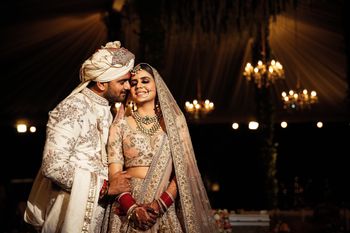 Photo of romantic couple shot with both bride and groom in pastels