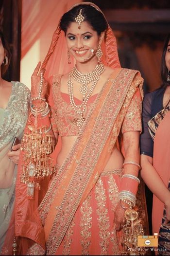 Peach and Light Orange Bridal Lehenga with Zardozi Work