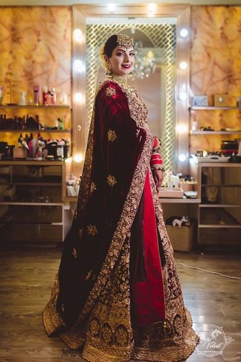 Photo of An over the top, stunning velvet bridal lehenga