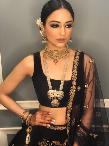 Stunning black lehenga with smokey eyes and bridal jewellery