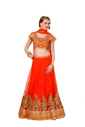 orange net layered lehenga with gold border