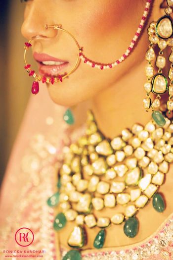 Photo of Gold Nath with Red and White Beads