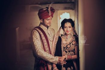Photo of black and gold bridal lehenga