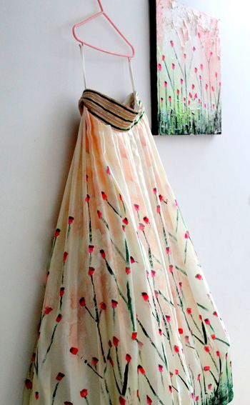 Photo of cherry blossom print lehenga with waist belt