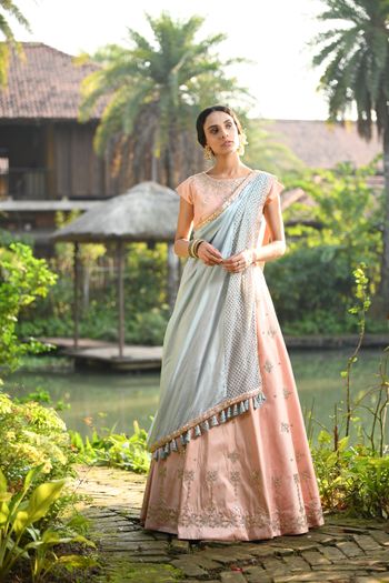 Photo of Beautiful peach lehenga with a pastel blue dupatta