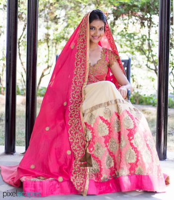 cream an bright pink lehenga