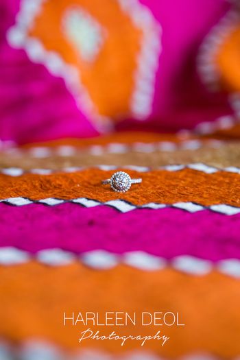 Solitaire engagement ring with halo setting