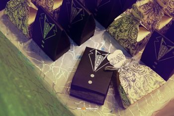 Photo of suit shaped box invites