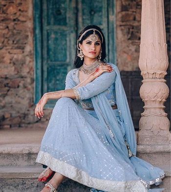 Photo of Engagement look with light blue lehenga and chunky silver jewellery