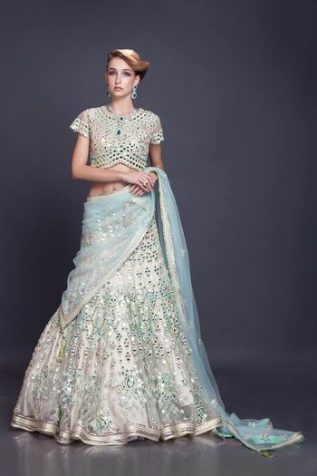 cream and pastel blue lehenga