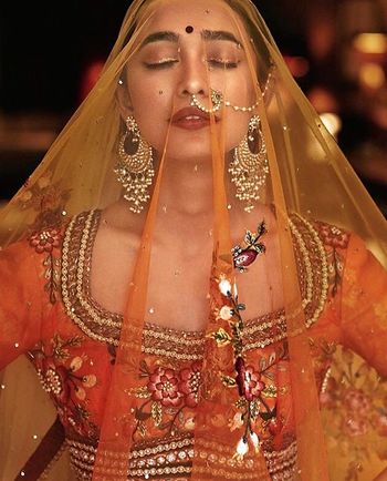Portrait with Bride in Burnt Orange Lehenga and Veil