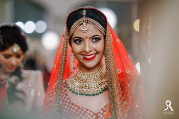 Happy bride shot with orange lipstick 