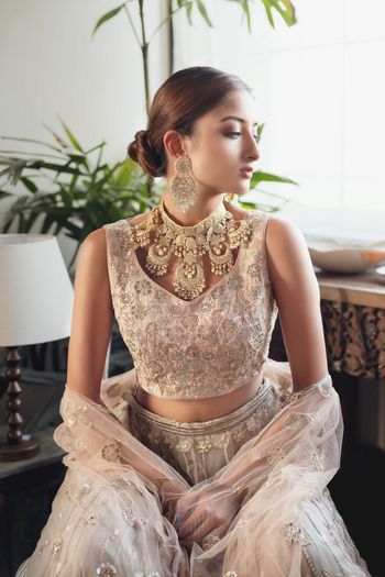 Photo of Unique heavy jewellery with light embroidered lehenga.
