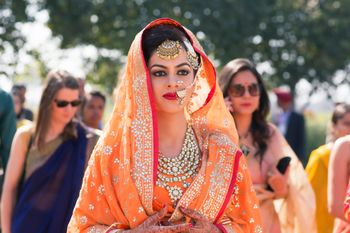 Bride Wearing Orange with Chunky Stone work Jewellery
