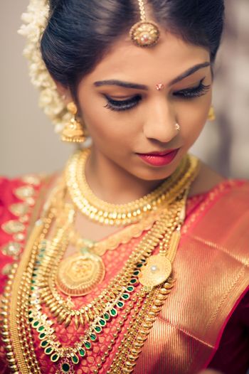 Photo of rust orange and red bridal kanjivaram