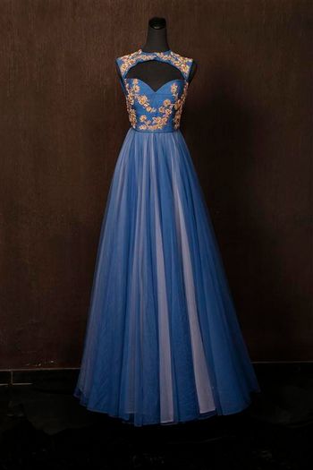 blue and grey floor length gown with peep hole cutout front