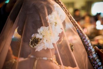 Photo of Bridal bun with white flowers