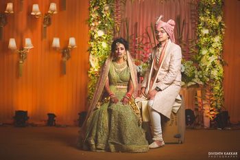 Photo of Contrasting bride and groom outfits in post wedding shoot