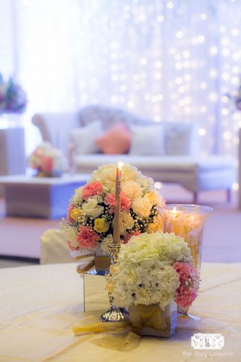 Photo of Floral centerpiece with flowers and candles