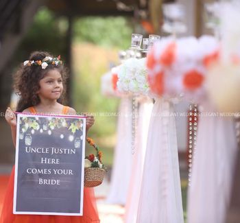 Photo of kid holding placard at wedding