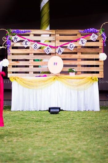 Photo of Counter for guests to leave messages for couple with rustic finish