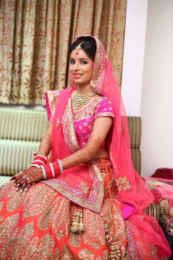 orange and pink bridal lehenga