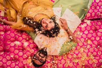 A gleeful flower shower couple shot