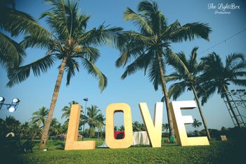 Photo of Backyard decor for mehendi with giant love blocks