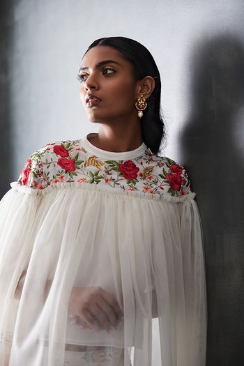 Photo of Floral embroidered cape in white