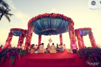 Photo of aqua and cherry mandap