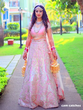 Photo of Light pink morning bride in benarasi lehenga