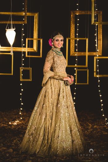 Photo of Sabyasachi gold floor length lehenga