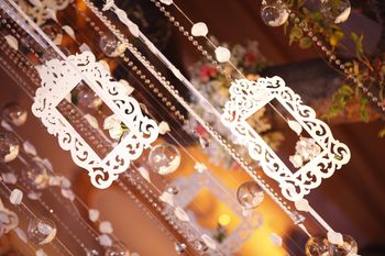 Photo of White hanging frames in decor.