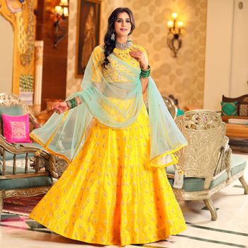 Bright yellow lehenga with light blue dupatta for mehendi