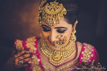 Bride with huge maangtikka and Nath