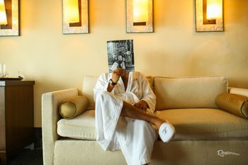 Photo of Cute groom getting ready shot
