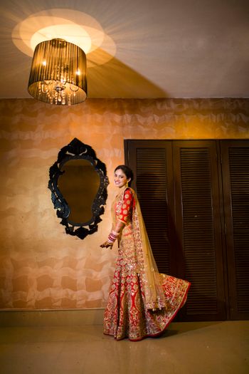 Photo of red and gold lehenga