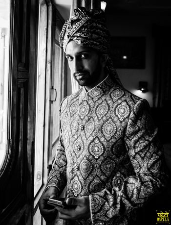 Photo of Timeless groom portrait in black and white