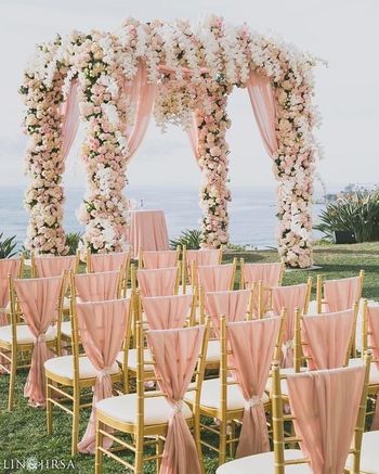 Pretty peach fairytale mandap and chair decor