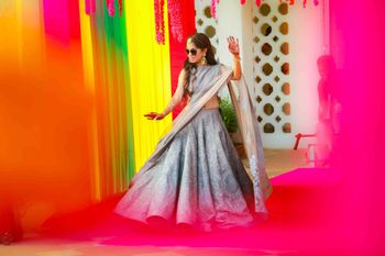 Bride dancing in grey mehendi lehenga