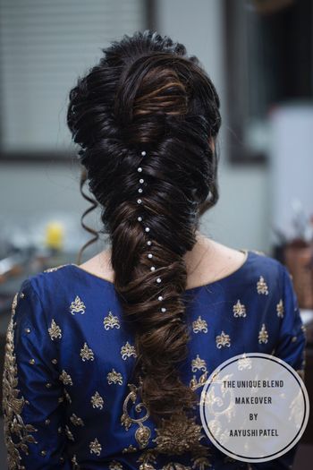 Unique braid with pearls in hair