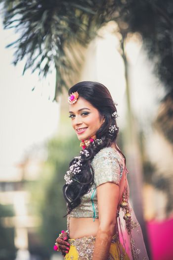 Photo of Mehendi braid with babys breath cascading