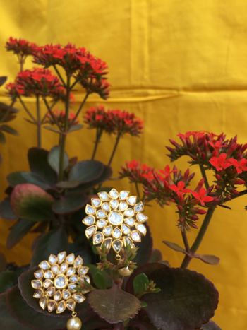 Floral shaped kundan earrings with pearl drops