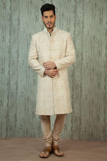 cream and white sherwani
