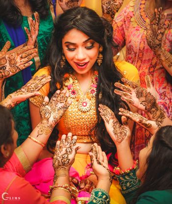 Beautiful bridal portrait with bridesmaids on mehendi 