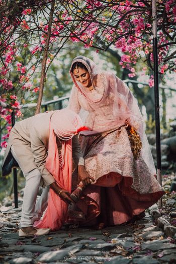 Photo of Cute couple portrait idea with groom helping bride