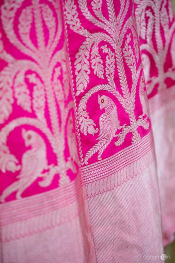 Bright pink benarasi lehenga with parrot motifs