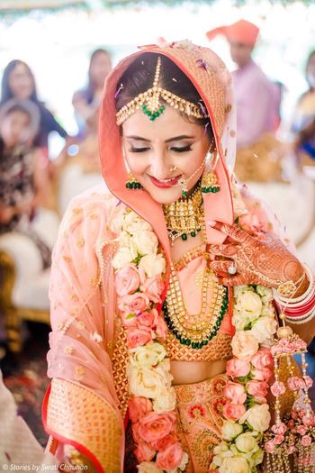 Stunning bridal kundan and emeralds jewelry  with unique floral kaleere