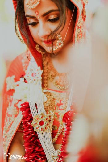 A bride in orange lehenga