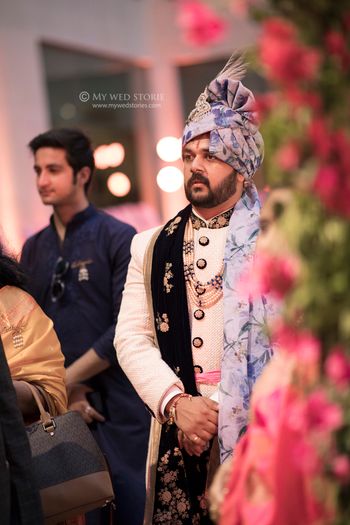 Groomwear trends with blue floral safa 